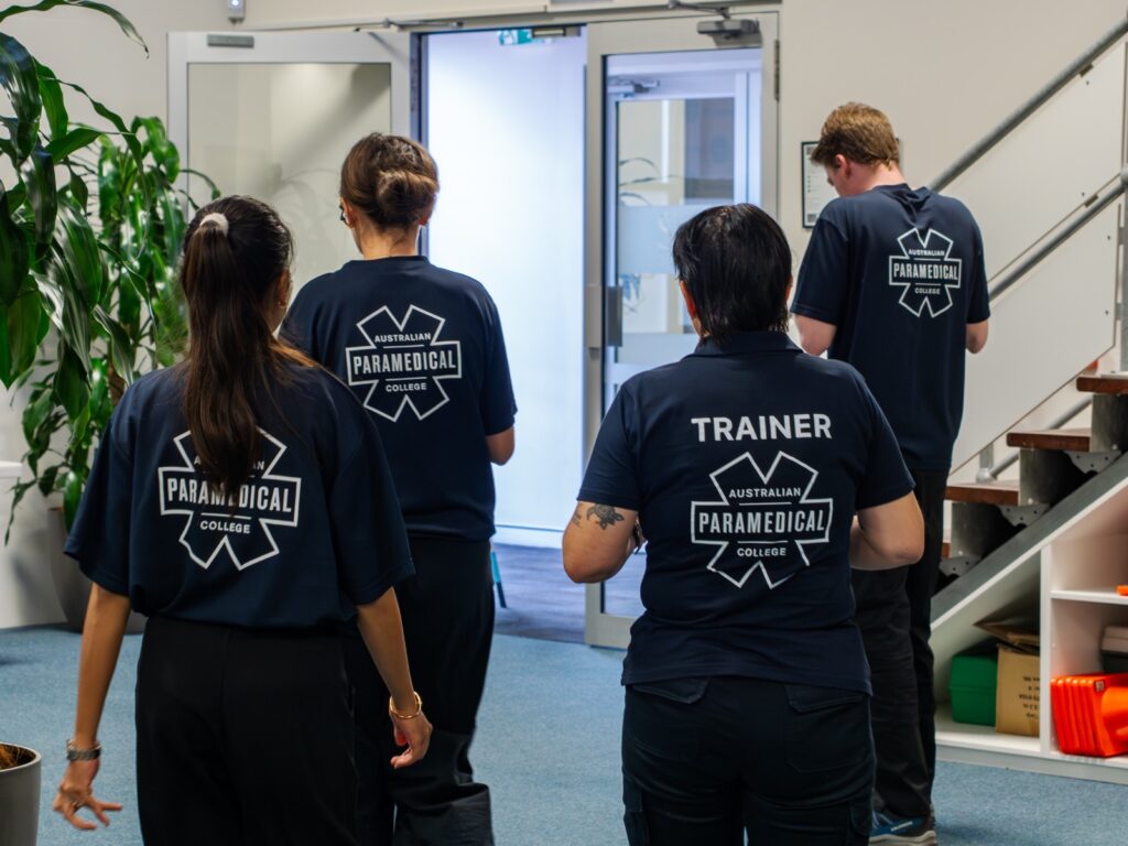 Pathology students walking through the training campus